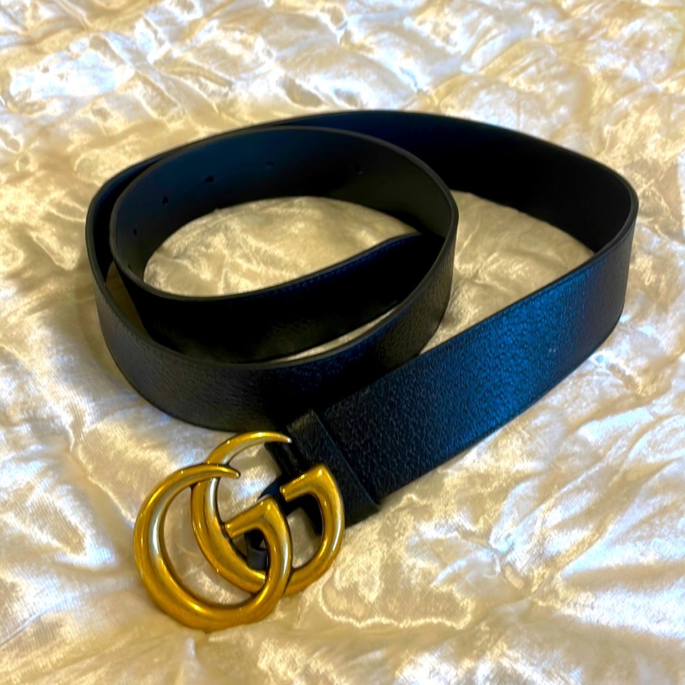 GUCCI BLACK LEATHER BELT; entire length of belt is 43. Inches, GG brass buckle.